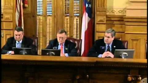 Senator Cecil P. Staton seated at the committee dais in the Georgia State Capitol